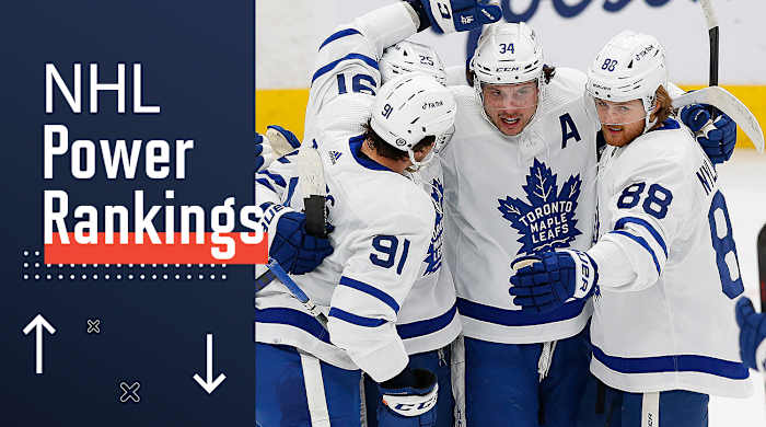 Auston Matthews celebrates with Maple Leafs teammates.
